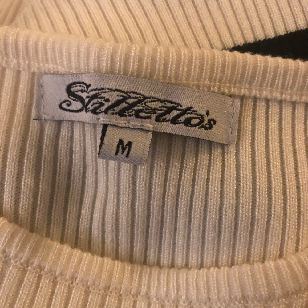 Stiletto’s cream bodycon dress.